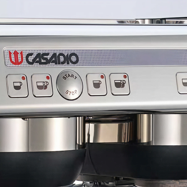 A close up of the buttons on an espresso machine.