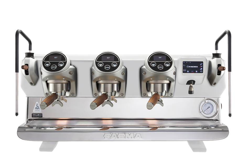 A row of four coffee machines on top of a table.