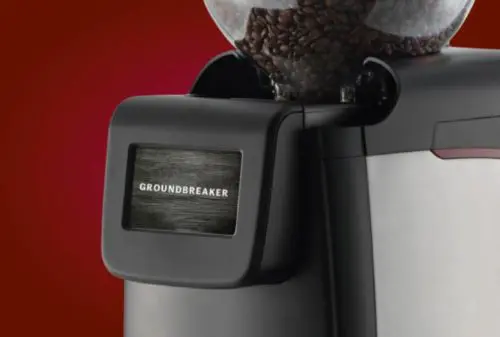 A close up of the ground coffee dispenser