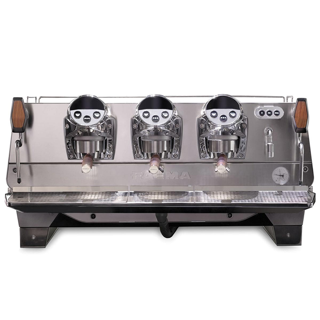 A silver machine with three different colored knobs.